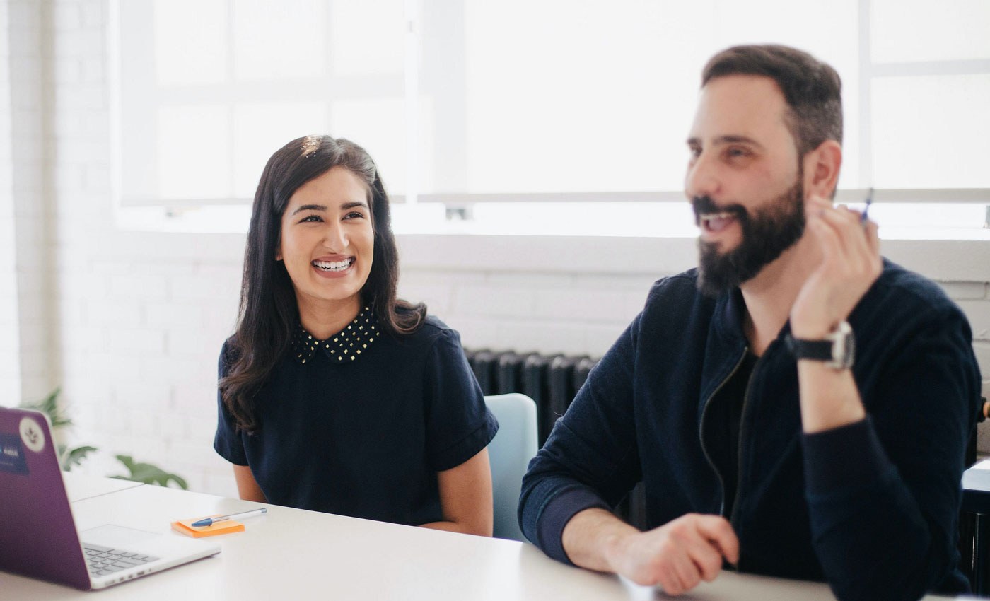 how to onboard new employees - man and woman smiling